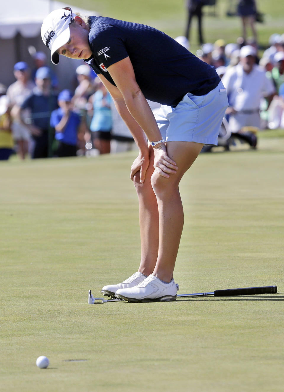 Stacy Lewis reacts after just missing a putt on the 18th hole during the third round of the North Texas LPGA Shootout golf tournament at the Las Colinas Country Club in Irving, Texas, Saturday, May 3, 2014. (AP Photo/LM Otero)