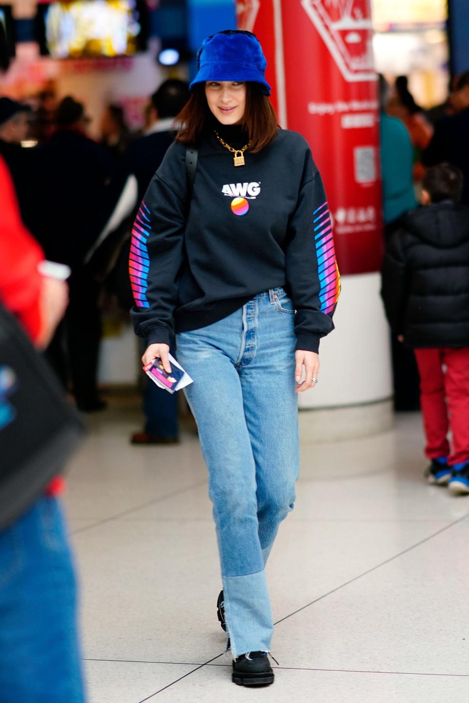 Not every trip needs to be a style moment—even Bella Hadid keeps it simple with a graphic hoodie and jeans.