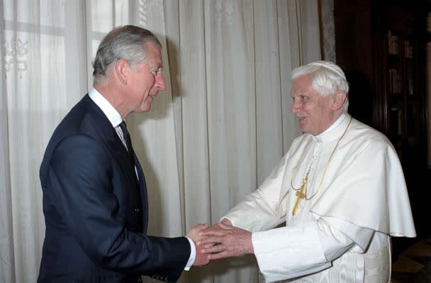 PHOTO: In this April 27, 2009, file photo, Pope Benedict XVI welcomes Britain's Prince Charles prior to their meeting in his private library in the Vatican. (AFP via Getty Images, FILE)