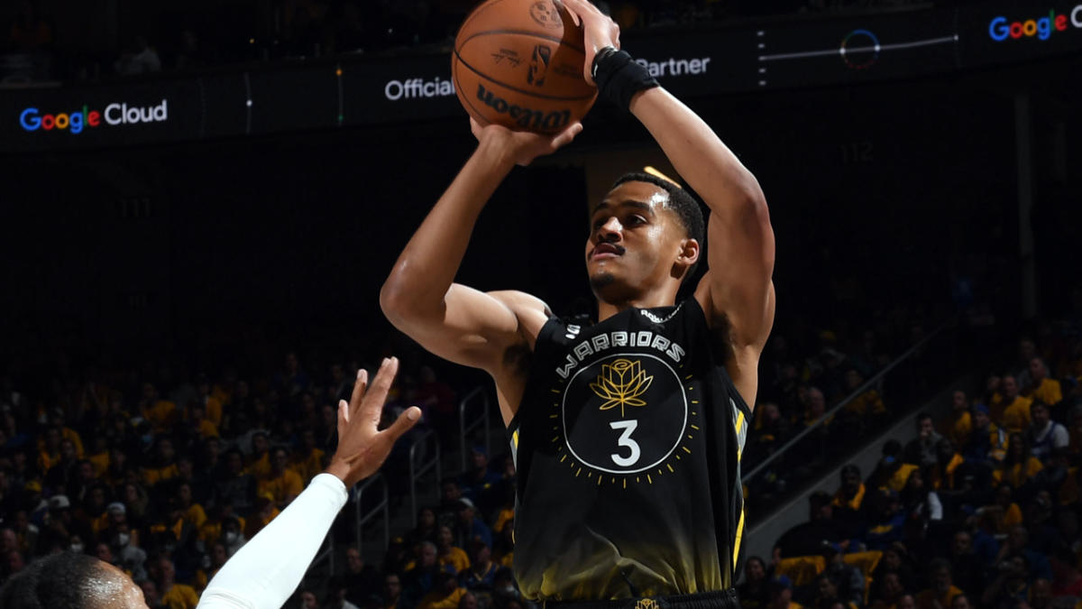 Golden State Warriors' Jordan Poole (3) reacts to San Francisco 49ers' Deebo  Samuel on the sideline after hitting a shot in the second half of an NBA  basketball game against the Memphis