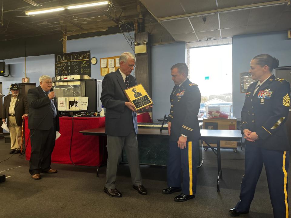 Christopher Siedor presenting Chrin's plaque to service members of Fort Indiantown Gap.
