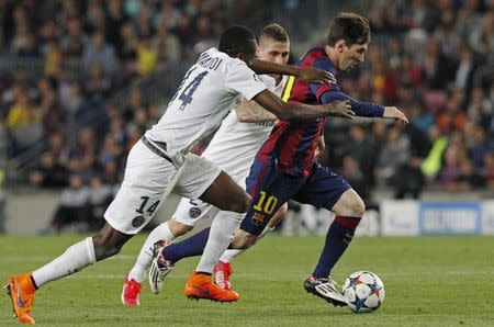 Football - FC Barcelona v Paris St Germain - UEFA Champions League Quarter Final Second Leg - Nou Camp, Barcelona - Spain - 21/4/15 Barcelona's Lionel Messi in action with PSG's Blaise Matuidi Reuters / Gustau Nacarino