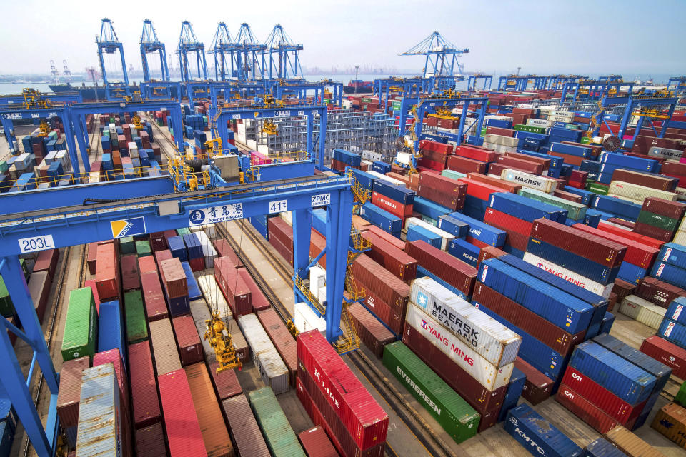 FILE - In this May 14, 2019, fiel photo, containers are piled up at a port in Qingdao in east China's Shandong province. China’s economic growth slowed to a 26-year low in the latest quarter as a tariff war with Washington weighed on exports and auto sales and other domestic activity weakened. The world’s second-largest economy expanded by 6.2 percent in the three months ending in September, down from the previous quarter’s 6 percent, data showed Friday, Oct. 18, 2019. (Chinatopix via AP, File)