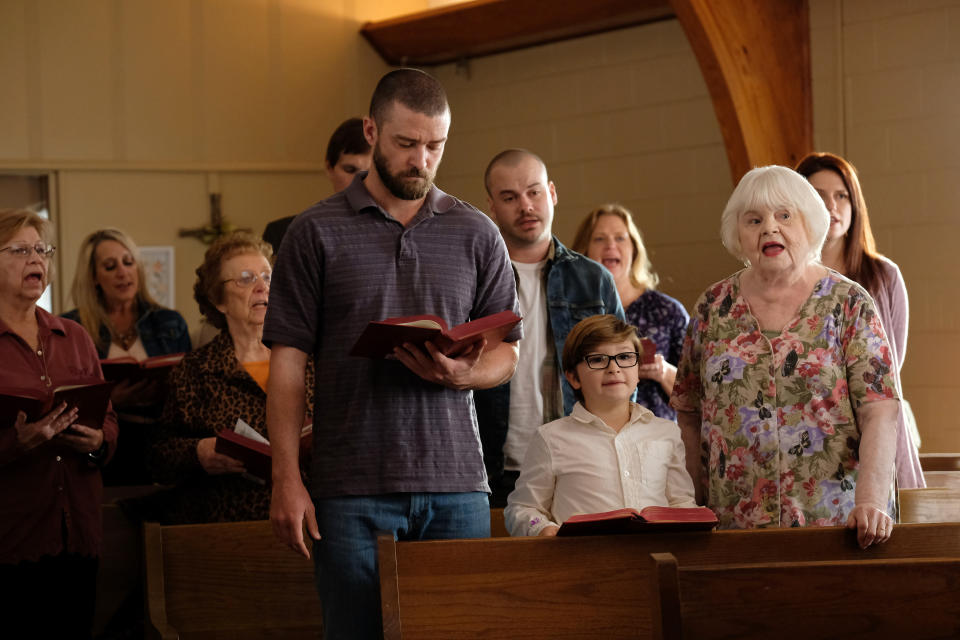 This image released by Apple shows, front row from left, Justin Timberlake, Ryder Allen and June Squibb in a scene from “Palmer.” (Apple via AP)