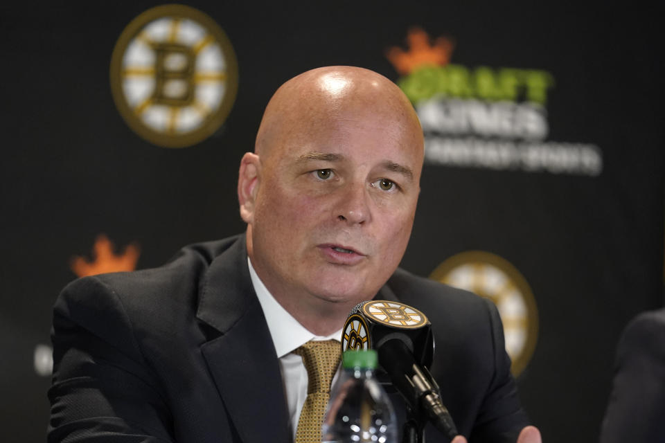 FILE - The Boston Bruins newly hired coach, Jim Montgomery, takes questions during a news conference July 11, 2022, in Boston. Montgomery will be judged on whether he gets more out of young players like Jake DeBrusk and Brandon Carlo, who bristled against former coach Bruce Cassidy's style. (AP Photo/Steven Senne, File)