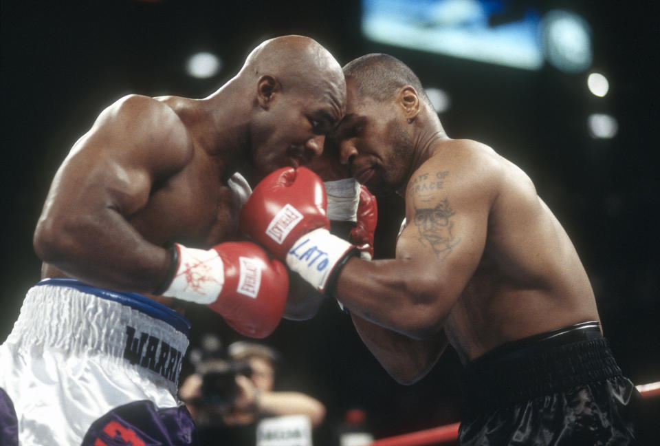 Evander Holyfield and Mike Tyson fight for WBA World Heavyweight Title on June 28,1997 at the MGM Grand Garden in Las Vegas, Nevada. The Fight was stop in the third round and Tyson was disqualified for biting Holyfield on both ears. (Photo by Focus on Sport/Getty Images)