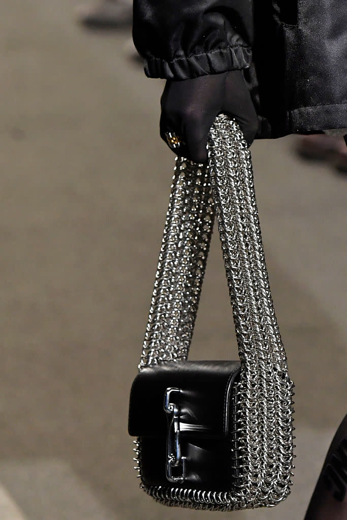 <p>A model carries a black multichain bag from the Alexander Wang FW18 show. (Photo: Getty Images) </p>