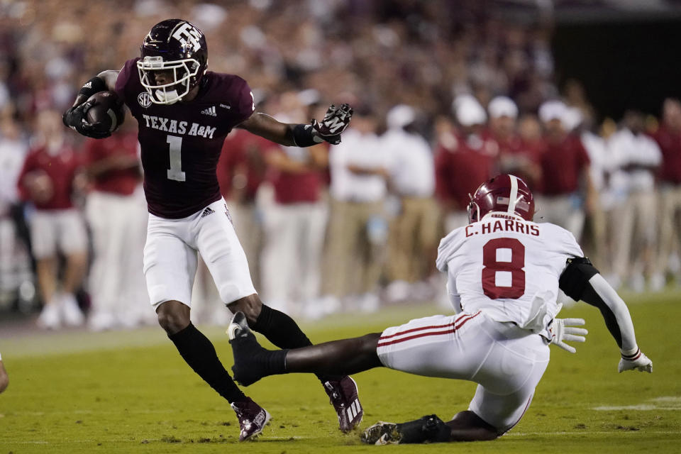 Texas A&M wide receiver Demond Demas (1) gets away from Alabama linebacker Christian Harris (8) during the first quarter of an NCAA college football game Saturday, Oct. 9, 2021, in College Station, Texas. (AP Photo/Sam Craft)