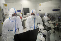 Laboratory technicians work at Valneva headquarters in Saint-Herblain, western France, Wednesday, Feb. 3, 2021. French pharmaceutical startup Valneva had big news in September: a government contract for 60 million doses of its coronavirus vaccine candidate. The buyer? The United Kingdom — not the European Union, as might be expected for a company on the banks of the Loire. (AP Photo/David Vincent)