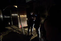 <p>People who evacuated from bars check their phones in the street in La Roma neighborhood of Mexico City, after an earthquake shook buildings forcefully and knocked out power in the area, just before midnight on Thursday, Sept. 7, 2017. (AP Photo/Rebecca Blackwell) </p>