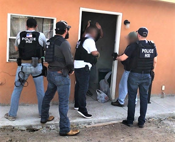 ICE Homeland Security Investigations agents raid an immigrant stash house in South-Central El Paso in 2019. File art.