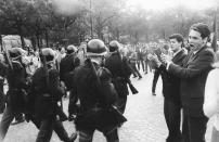 <p>The crowd applauds the police during a Gaullist demonstration, Avenue Victor Hugo, Paris, May 30, 1968. (Photo: Gökşin Sipahioğlu/SIPA) </p>