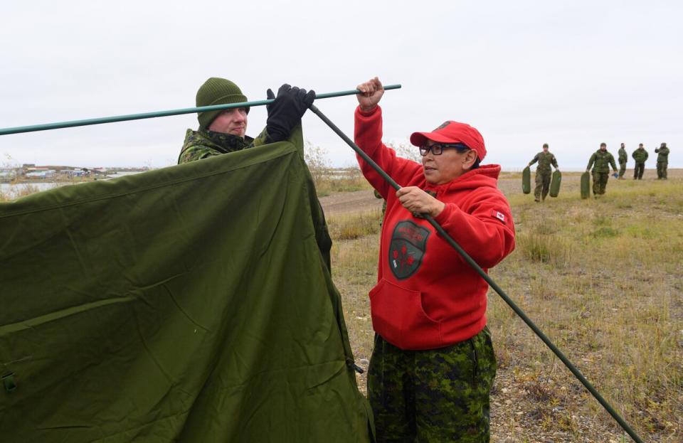 Canadian Armed Forces personnel, accompanied by Cpl. Beverly Kingmiaqtuq of the Canadian Rangers, set up camp near an observation post during Operation NANOOK- NUNAKPUT 2023, in Tuktoyaktuk, Northwest Territories, on August 30, 2023. 