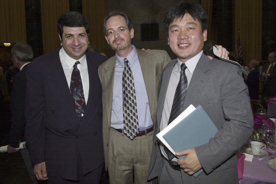 FILE - The Associated Press', from left, Investigative Researcher Randy Herschaft, Special Assignment Editor J. Robert Port and Seoul newsman Sang-hun Choe pose at Columbia University for the Pulitzer Prize luncheon, May 22, 2000, in New York. Port, who led The AP investigative team that won a 2000 Pulitzer Prize for Investigative Reporting for the No Gun Ri massacre probe, died Saturday, Feb. 17, 2024, in Lansing, Mich. He was 68. (AP Photo/Kathy Willens)