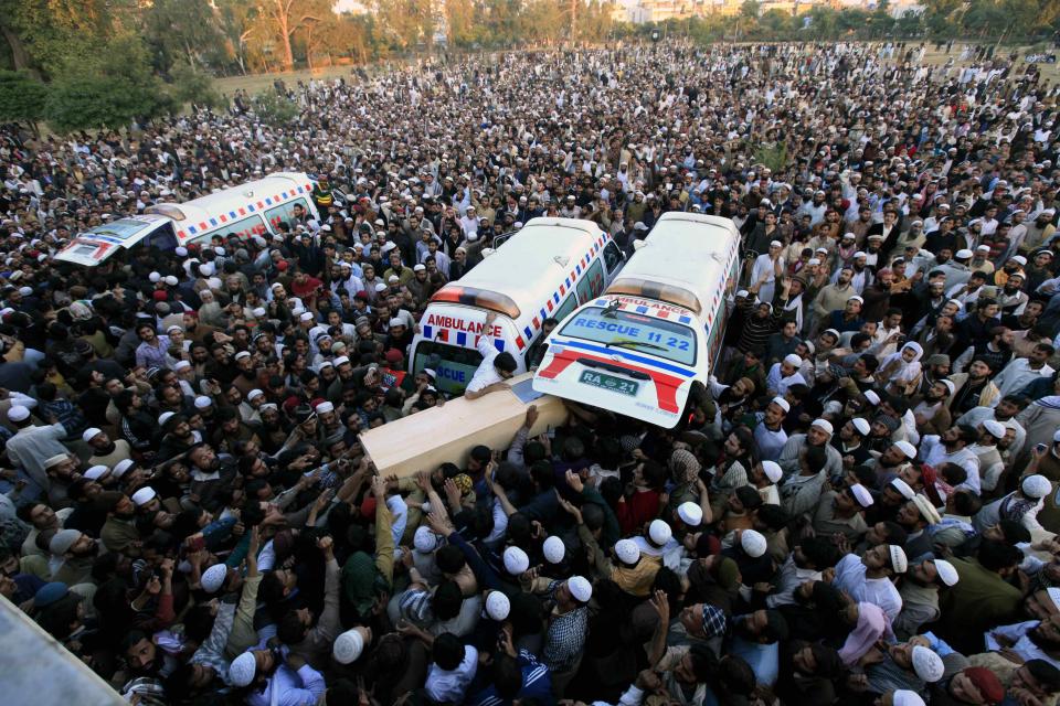 Sunni Muslims carry the casket of a fellow Sunni who was killed in Friday's sectarian clashes during a Muharram procession, at Laiquat Bagh in Rawalpindi