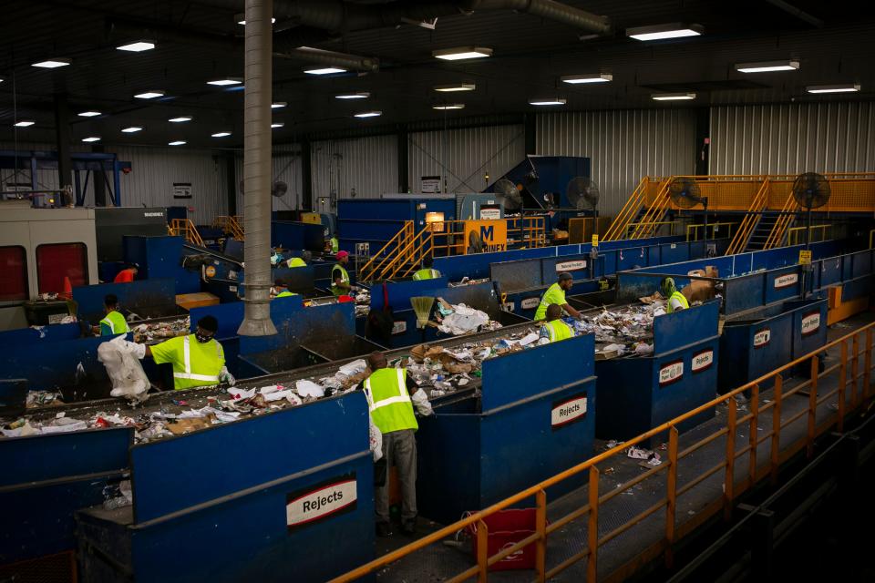 Materials are sorted and divided up at the Rumpke Recycling Facility on August 24, 2021. 