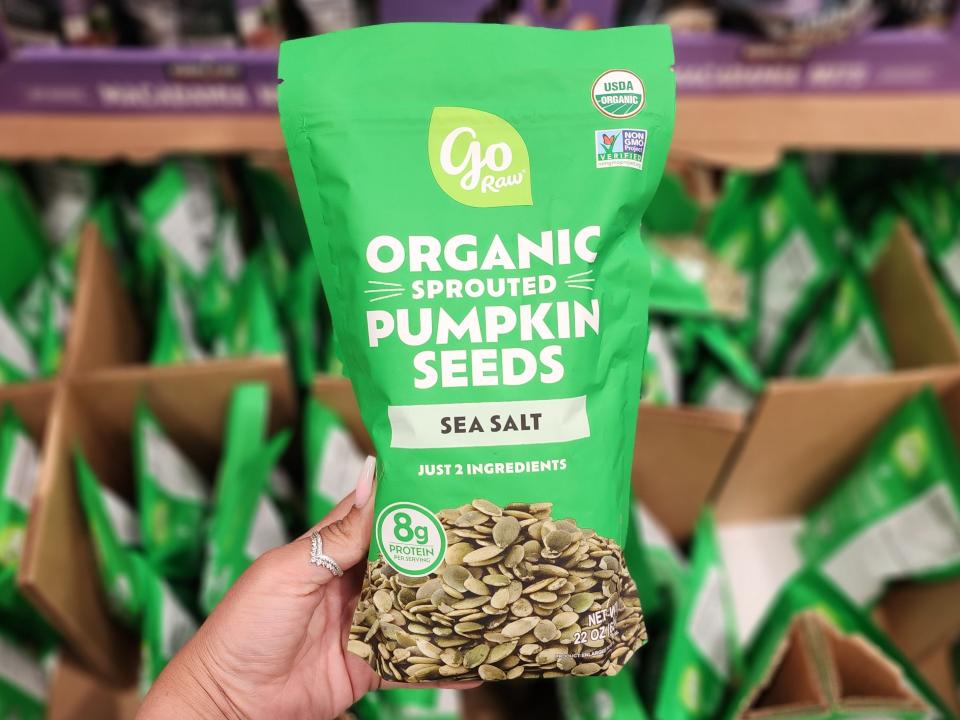 A green bag of Go Raw pumpkin seeds