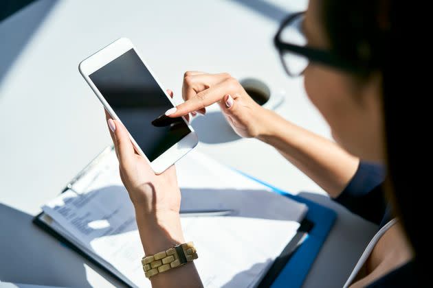 Keep an audio clip on your phone with a pre-recorded message about your allergy in the language of the place you're visiting. (Photo: Westend61 via Getty Images)