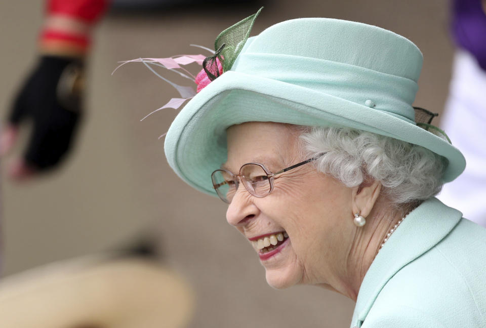 Britain's Queen Elizabeth II smiles, during day five of of the Royal Ascot horserace meeting, at Ascot Racecourse, in Ascot, England, Saturday June 19, 2021. (David Davies/PA via AP)