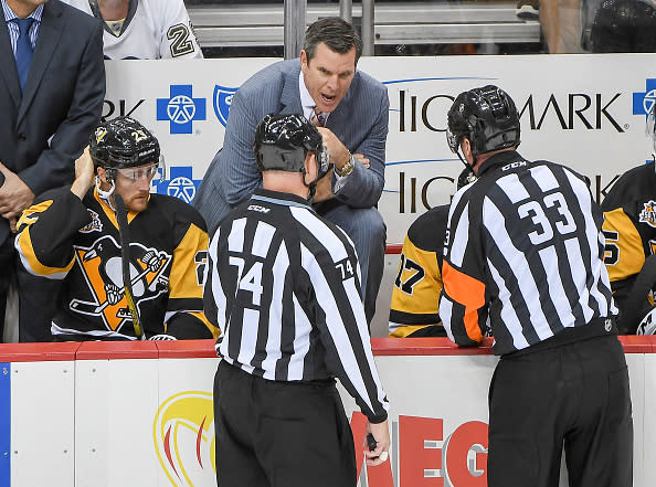 PITTSBURGH, PA - OCTOBER 20: Head coach Mike Sullivan of the Pittsburgh Penguins gets an explanation from referee Kevin Pollock #33 after a goal was waved off in second period during the game against San Jose Sharks at PPG PAINTS Arena on October 20, 2016 in Pittsburgh, Pennsylvania. (Photo by Justin Berl/Getty Images)