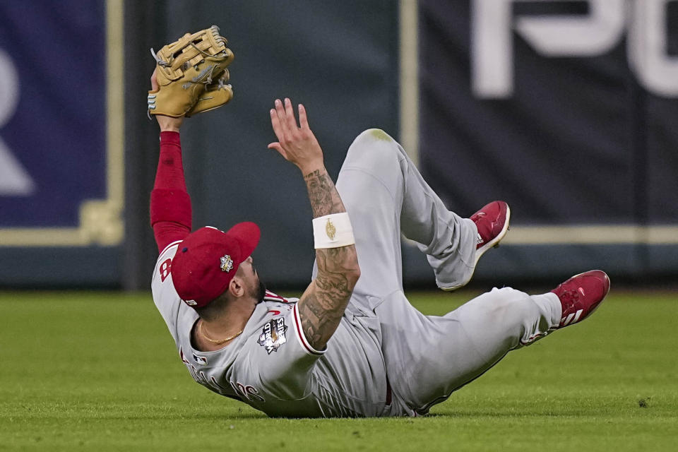 Philadelphia Phillies right fielder Nick Castellanos catches a fly ball hit by Houston Astros' Jeremy Pena to end the ninth inning in Game 1 of baseball's World Series between the Houston Astros and the Philadelphia Phillies on Friday, Oct. 28, 2022, in Houston. (AP Photo/Eric Gay)