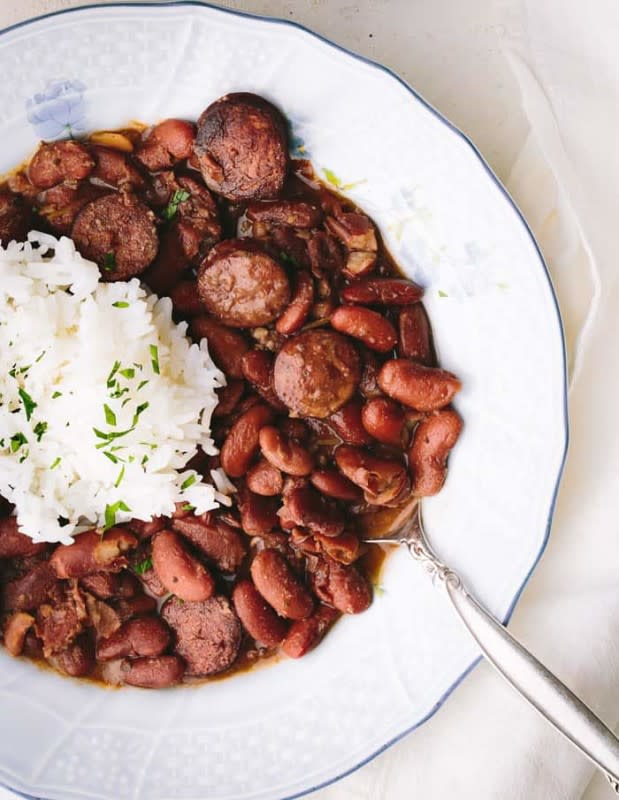 <p>Grandbaby Cakes</p><p>This BEST Red Beans and Rice Recipe is the Ultimate Cajun favorite done right! Insanely flavorful kidney beans with a hint of spice and meaty essence are served over white rice for the perfect Southern Creole recipe.</p><p><strong>Get the recipe: <a href="https://grandbaby-cakes.com/cajun-red-beans-and-rice/" rel="nofollow noopener" target="_blank" data-ylk="slk:The Best Red Beans and Rice Recipe;elm:context_link;itc:0;sec:content-canvas" class="link rapid-noclick-resp">The Best Red Beans and Rice Recipe</a></strong></p>