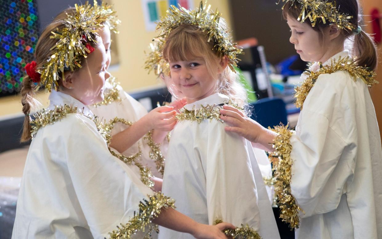 O come let us adore them: rehearsals at St Gregory's Primary School in Sudbury - David Rose