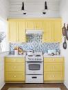 <p>In order to complement this exciting tile backsplash, these kitchen cabinets needed a fresh coat of paint that shined just as bright. <a href="https://www.sherwin-williams.com/homeowners/color/find-and-explore-colors/paint-colors-by-family/SW9018-honey-bees" rel="nofollow noopener" target="_blank" data-ylk="slk:Honey Bees by Sherwin-Williams;elm:context_link;itc:0;sec:content-canvas" class="link ">Honey Bees by Sherwin-Williams</a> did just the trick to finish out the ultimate country color combo of blue, yellow, and white in this 98-square-foot kitchen.</p>