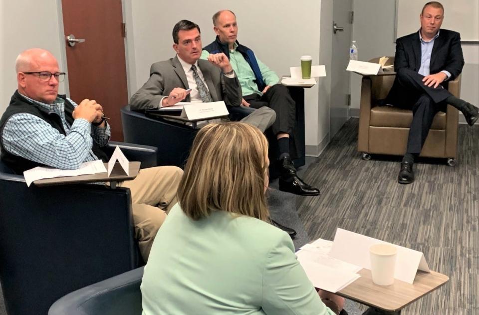 William Timmons heard from business leaders Tuesday during an Upstate Economy Roundtable at Spartanburg Community College's Downtown Campus. At bottom center is accountant Jessica Coker. From left are Andy Hall of Melotte Enterprises, Dr. Michael Mikota of Spartanburg Community College, Michael Emory of The Emory Group and William Crawford of Simple Storage Solutions.