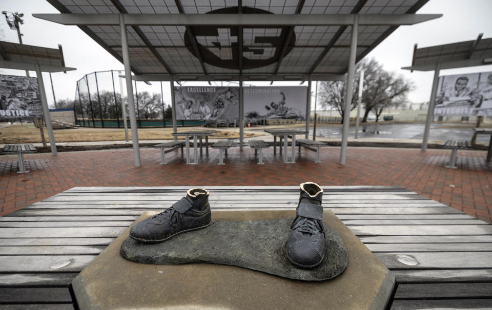 A bronze statue of legendary baseball pioneer Jackie Robinson was stolen from a park in Wichita, Kan., during the early morning hours of Thursday, Jan. 25, 2024. The statue, valued at $75,000, was the centerpiece of the League 42 ballpark facility, a baseball league started in 2015 to help kids with little access to organized sports. The league currently has 600 kids signed up to play this spring. Wichita police said during a Friday news conference that they are working desperately to catch the thieves. (Travis Heying/The Wichita Eagle via AP)