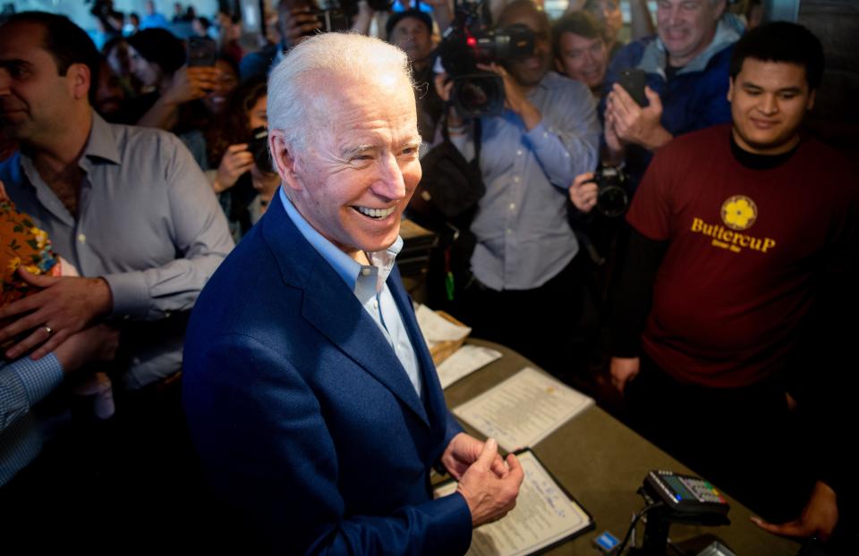 Democratic presidential candidate Joe Biden buys a pie at Buttercup Diner in Oakland, California on Super Tuesday, March 3, 2020.