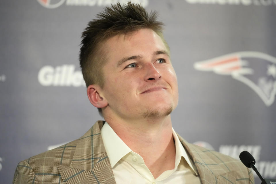 New England Patriots quarterback Bailey Zappe speaks during a news conference after an NFL football game at Empower Field at Mile High, Sunday, Dec. 24, 2023, in Denver. (AP Photo/David Zalubowski)