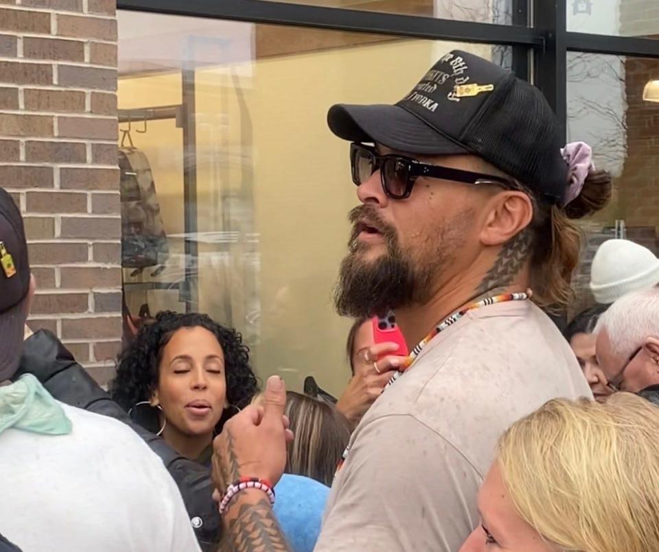 Jason Momoa promotes his new premium vodka brand, Meili, with co-founder and friend Blaine Halvorson outside Brookfield's Total Wine & More on Thursday.