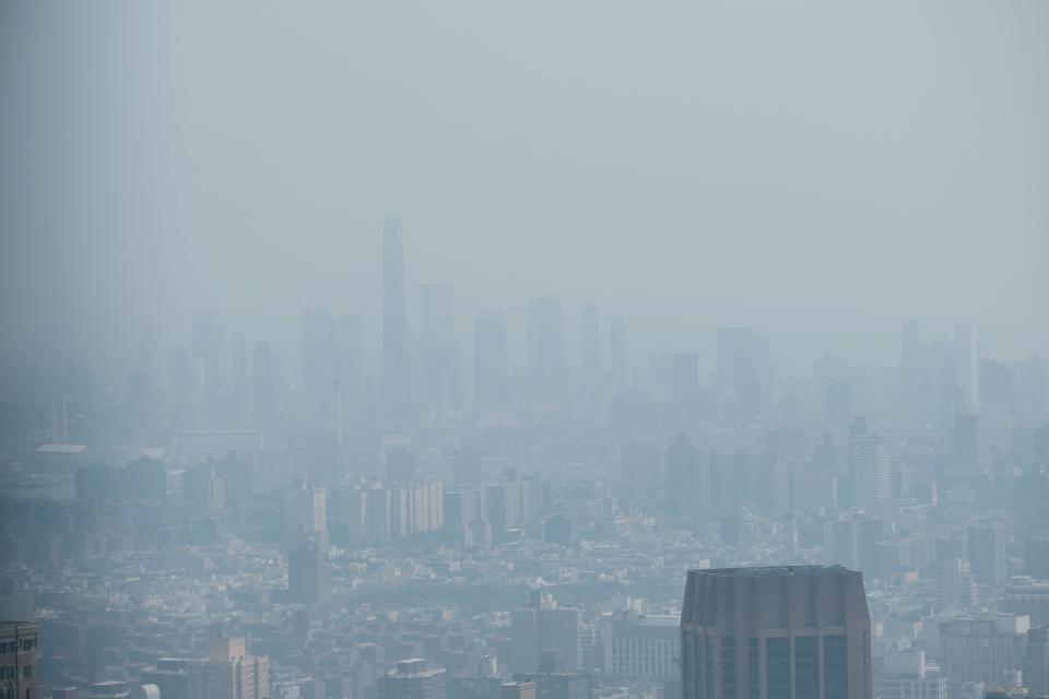 NEW YORK, NEW YORK - JUNE 06: Manhattan is enveloped in a dense haze caused by wildfires in Canada on June 06, 2023 in New York City. Over 100 wildfires are burning in the Canadian province of Nova Scotia and Quebec resulting in air quality health alerts for the Adirondacks, Eastern Lake Ontario, Central New York and Western New York.