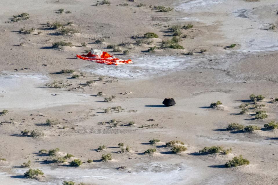 DUGWAY, UTAH - SEPTEMBER 24: In this handout provided by NASA, the sample return capsule from NASA's OSIRIS-REx mission is seen shortly after touching down in the desert, on September 24, 2023 at the Department of Defense's Utah Test and Training Range in Dugway, Utah. The sample was collected from the asteroid Bennu in October 2020 by NASA's OSIRIS-REx spacecraft. (Photo by Keegan Barber/NASA via Getty Images)