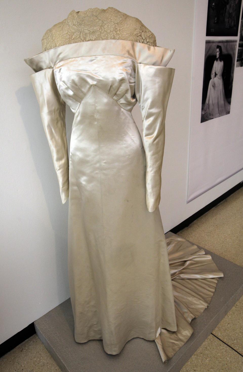 A white satin and lace wedding dress by Howard Greer, from the 1934 production of "The Lake," is shown as part of the "Katharine Hepburn: Dressed for Stage and Screen" exhibit in the New York Public Library for the Performing Arts at Lincoln Center, Tuesday, Oct. 16, 2012. (AP Photo/Richard Drew)