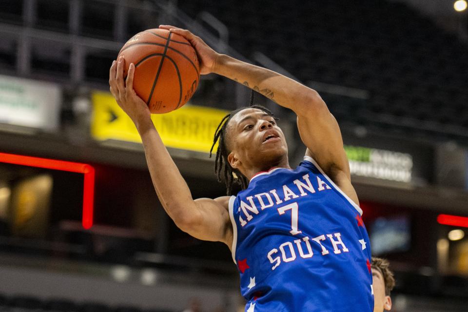 South Future All-Star K.J. Windham (7), a junior from Ben Davis High School, pulls down a rebound during the second half of an boysâ€™ Indiana High School Future All-Stars basketball game, Saturday, June 10, 2023, at Gainbridge Fieldhouse, in Indianapolis.