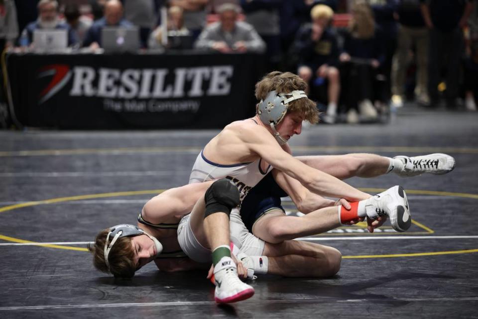 Bald Eagle Area’s Caden Judice scrambles with Notre Dame Green Pond’s Cooper Feltman in their 121-pound match of the Eagles’ 41-16 loss on Thursday in the PIAA Class 2A dual championships first round match. Judice topped Feltman, 4-2, in sudden victory.