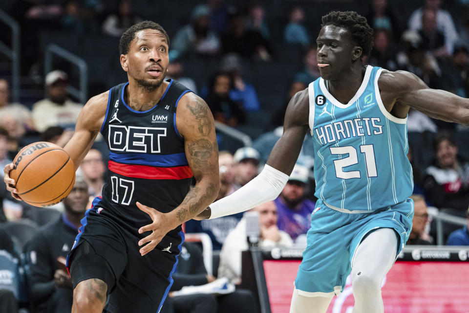 Detroit Pistons guard Rodney McGruder (17) drives to the basket while defended by Charlotte Hornets forward JT Thor (21) during the first half of an NBA basketball game in Charlotte, N.C., Monday, Feb. 27, 2023. (AP Photo/Jacob Kupferman)