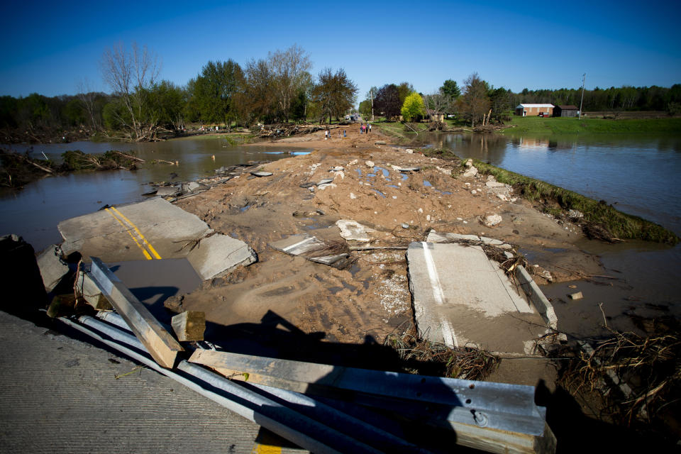 Ruins of the Curtis Road Bridge lie asunder as waters continue to roil on May 20, 2020, in Edenville Township north of Midland. After two days of heavy rain, the Edenville Dam failed and floodwaters rushed south, ravaging the landscape in its path.  (Photo: Jake May/The Flint Journal, MLive.com via AP)