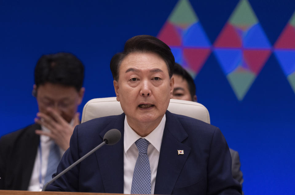 South Korean President Yoon Suk Yeol talks to Japanese Prime Minister Fumio Kishida and Chinese Premier Li Qiang, duo not pictured, during their trilateral meeting at the blue house in Seoul, South Korea Monday, May 27, 2024. (Jeon Heon-kyun/Pool Photo via AP)