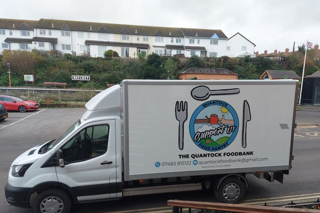 A white van with the wording The Quantock Foodbank written on the side