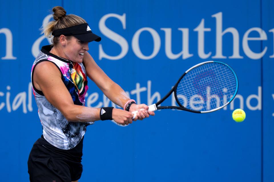 Caty McNally returns to Aliaksandra Sasnovich during the Western & Southern Open at the Lindner Family Tennis Center in Mason, Ohio Monday, Aug. 15, 2022.