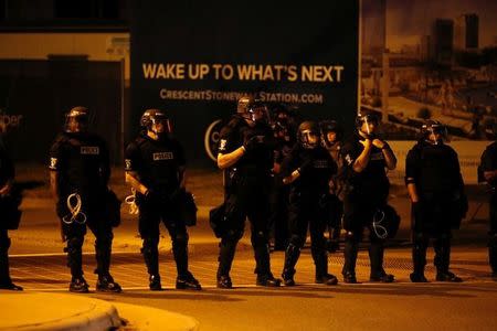 Police monitor marchers protesting the police shooting of Keith Scott in Charlotte, North Carolina, U.S. September 24, 2016. REUTERS/Jason Miczek