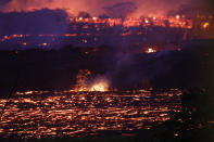 <p>Lava from a Kilauea volcano fissure flows on Hawaii’s Big Island on May 19, 2018 in Kapoho, Hawaii. (Photo: Mario Tama/Getty Images) </p>