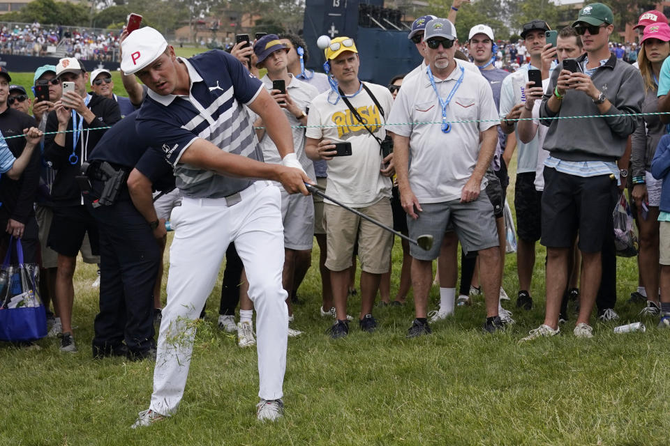 Bryson DeChambeau hits from the 11th fairway rough during the final round of the U.S. Open Golf Championship, Sunday, June 20, 2021, at Torrey Pines Golf Course in San Diego. (AP Photo/Marcio Jose Sanchez)