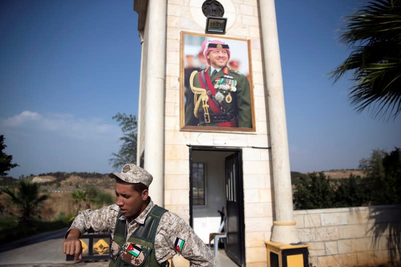 A Jordanian soldier stands near the "Island of Peace" in an area known as Naharayim in Hebrew and Baquora in Arabic, on the Jordanian side of the border with Israel