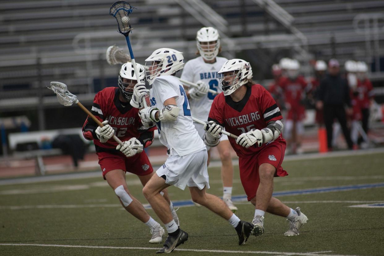 Harper Creek senior Trace Clark (20) passes the ball at Harper Creek High School on Wednesday, May 18, 2022.