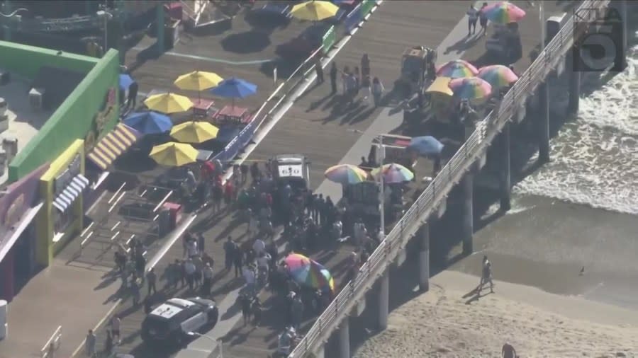 Police evacuated the Santa Monica Pier after a man scaled the Ferris wheel at Pacific Park on Oct. 9, 2023. (KTLA)