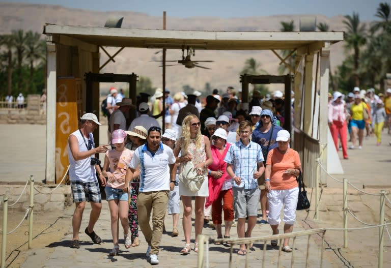 Tourists pass through a security checkpoint as they visit Karnak temple in Luxor, Egypt, on June 11, 2015